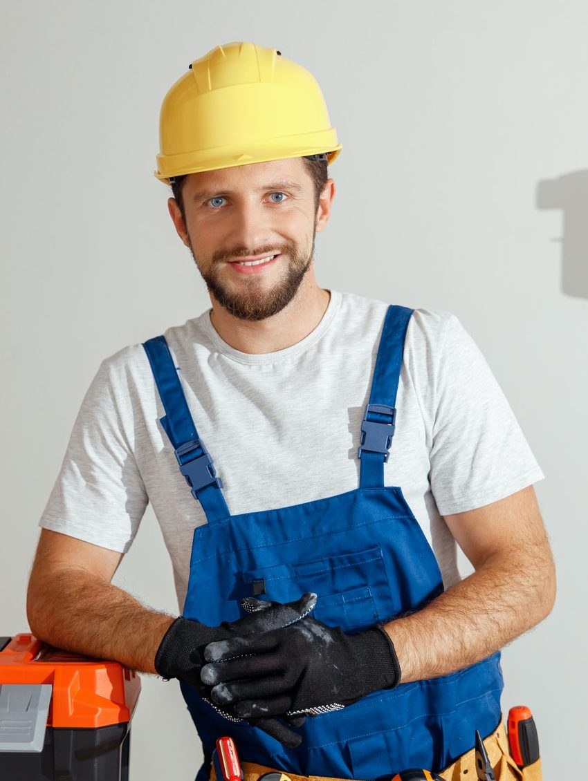 cheerful electrician technician in uniform hard hat and protective gloves smiling at camera while e1651083969223.jpg